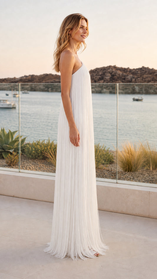 Side profile of model in white pleated column evening gown