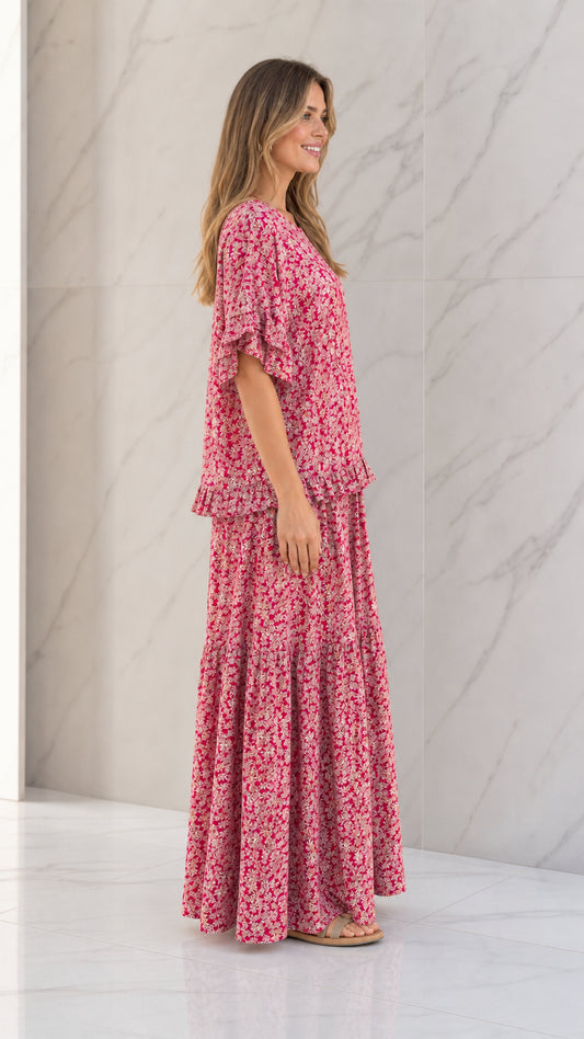 Side full view of woman wearing Rose Pink floral matching two-piece set