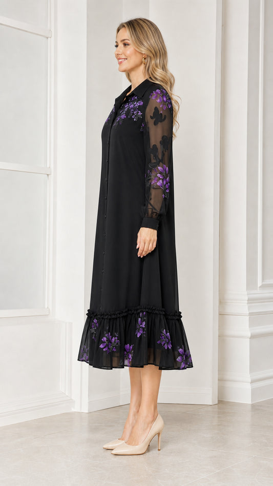 Side profile of woman wearing black floral embroidered midi dress