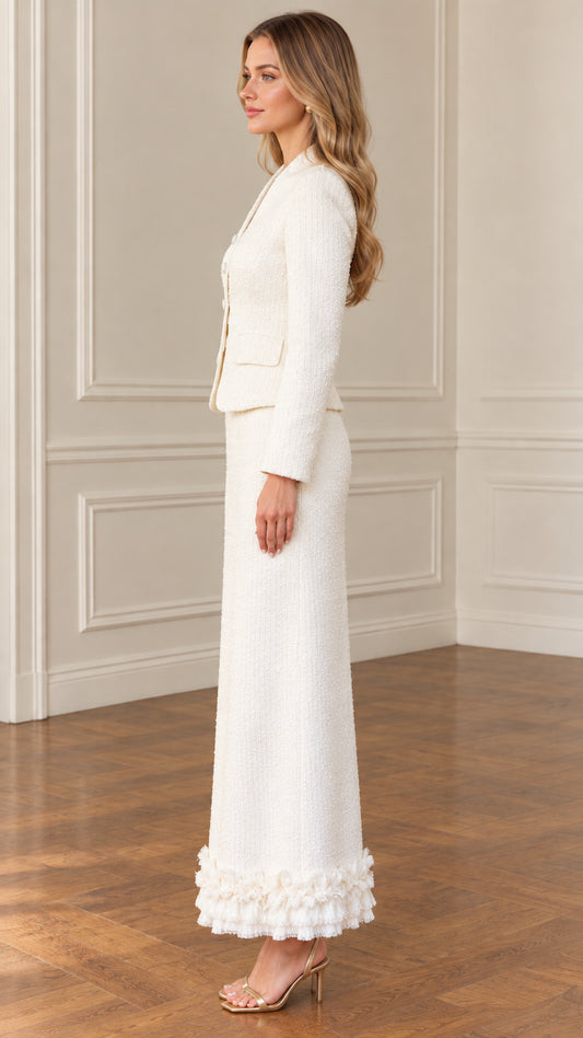 Side profile view of ivory tweed long skirt suit with tailored blazer