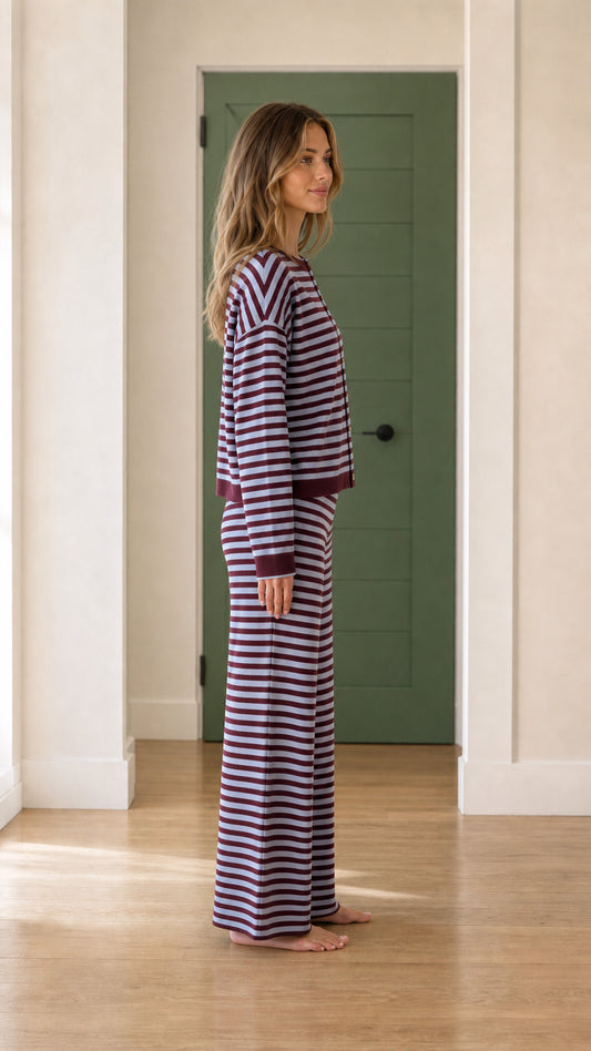 Side profile of model wearing purple striped loungewear set