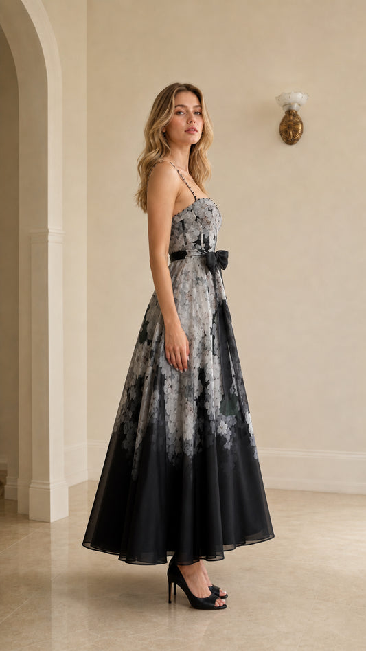 Side profile view of black floral ombre maxi dress