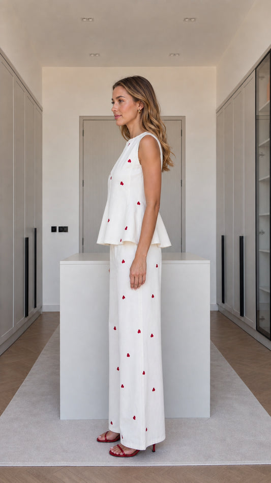 Side profile of model in white matching pant set