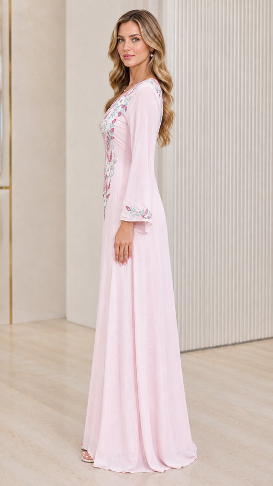 Side angle view of woman wearing Light Pink embroidered floor-length dress