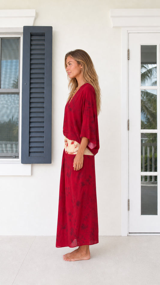 Side profile view of model in Wine Red v-neck draped maxi dress