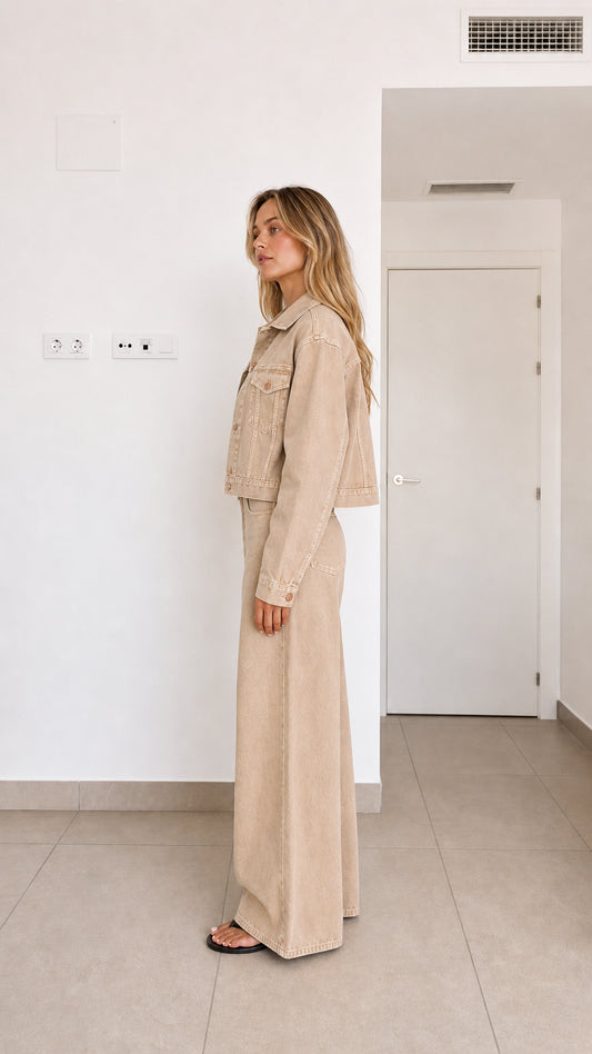 Side view of woman in beige two-piece wide-leg denim coordinate set
