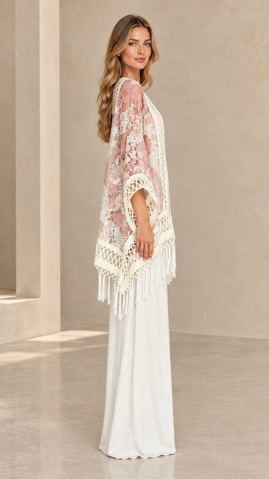 Side profile of woman showcasing the drape and sleeve of blush pink lace kimono
