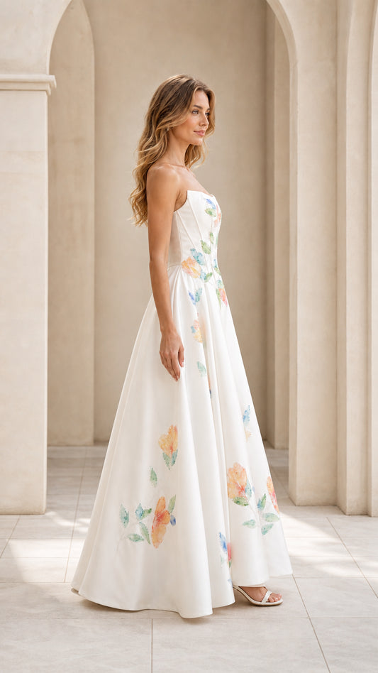 Side view of model wearing white floral strapless A-line evening gown