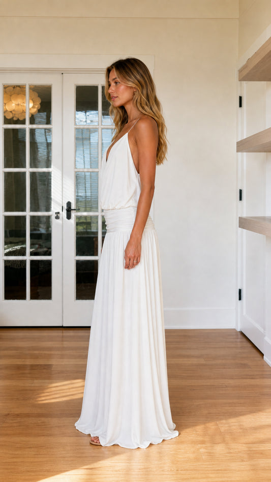 Side profile view of white maxi dress