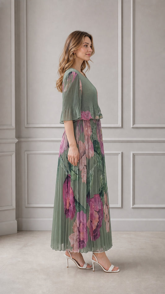 Side angle view of sage green pleated floral maxi dress with flutter sleeves