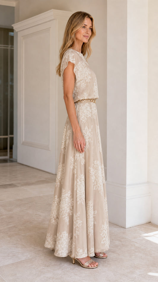 Model wearing Champagne floral embroidered maxi dress from the side view