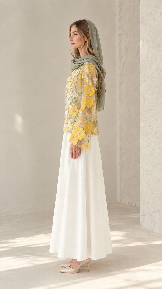 Side view of model wearing white modest dress set with floral embroidered overlay