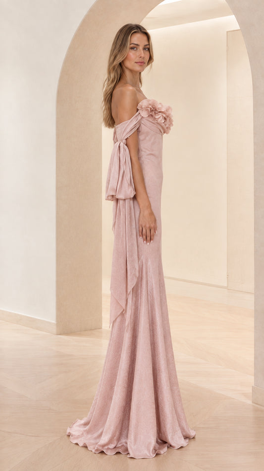 Dusty pink floor-length gown with draped sleeves side profile view
