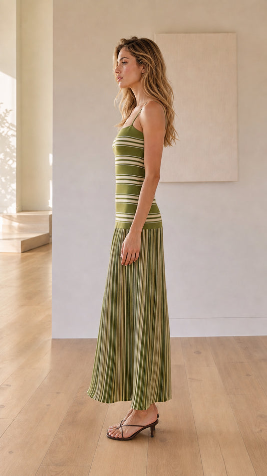 Woman wearing olive green striped knit maxi dress side view