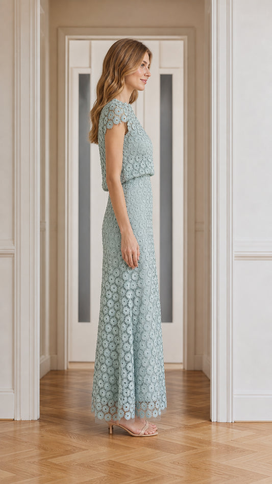 Model wearing sage green floral lace maxi dress, side profile