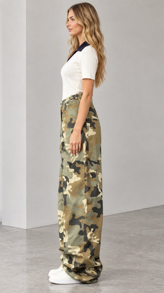 Side profile view of woman wearing army green camouflage baggy cargo pants