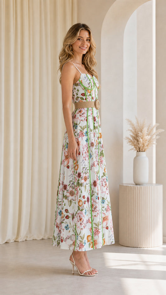 Side profile of model in white floral maxi dress