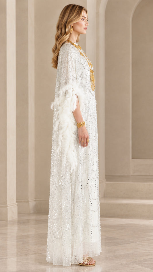 Side profile of white sequined evening kaftan dress with feather cuffs