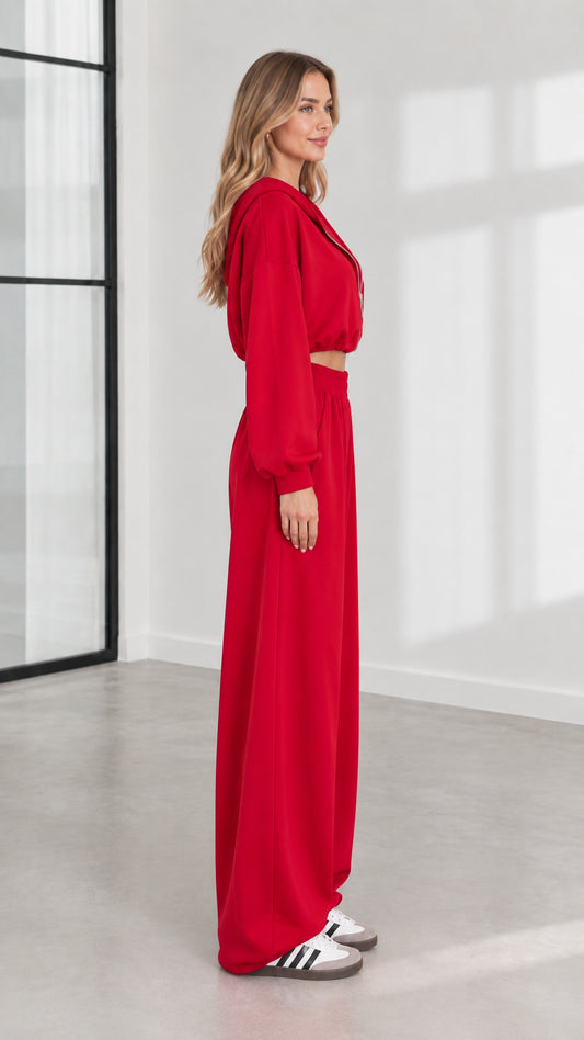 Side profile of model in red cropped hoodie and wide-leg pants set