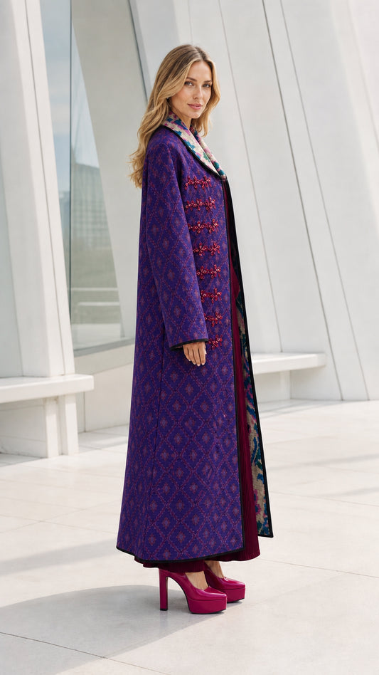 Side profile view of model in purple long coat