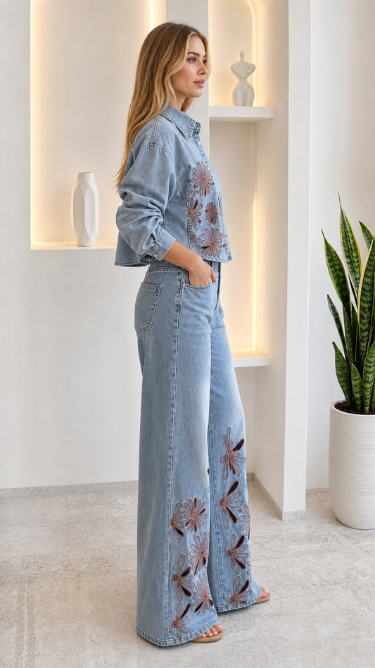 Side profile of woman in light blue floral cutout denim co-ord set