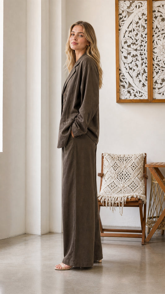 Side profile of model in olive two-piece pants set