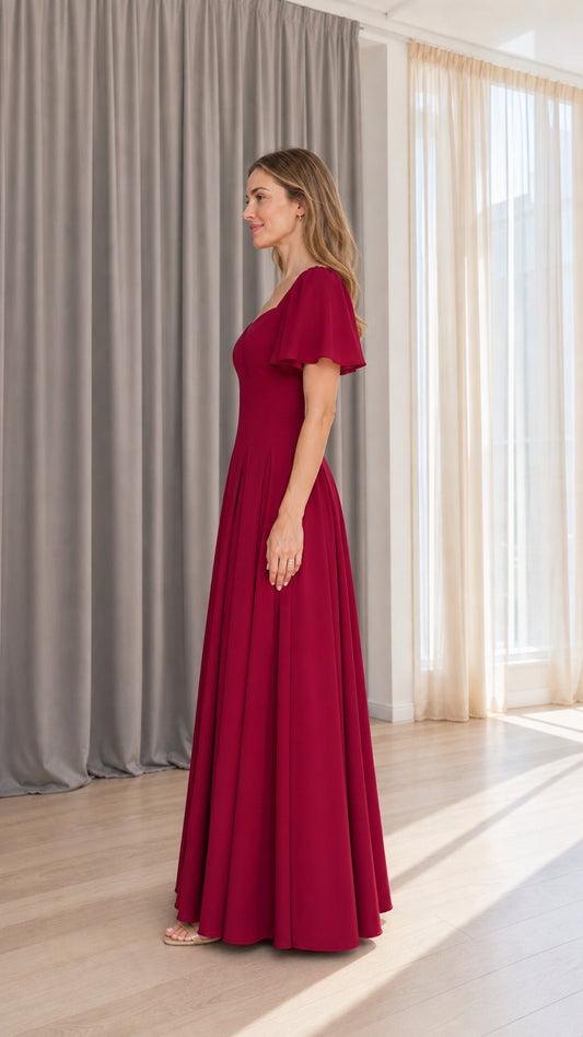 Side profile view of burgundy flutter sleeve maxi dress
