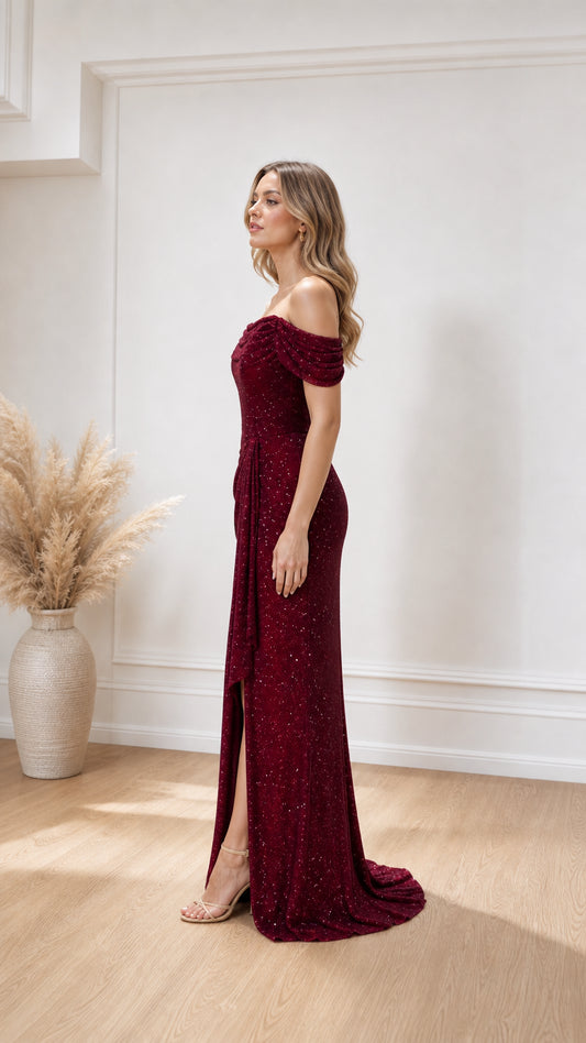 Side profile view of burgundy evening gown