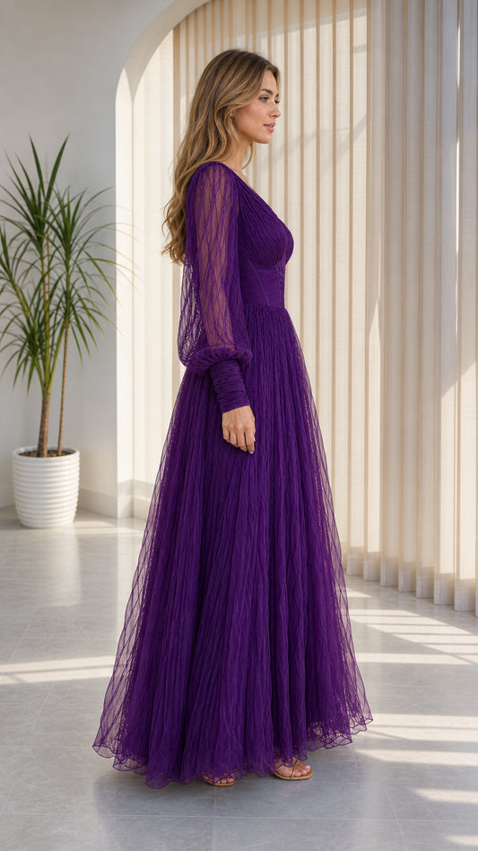 Side view of purple pleated tulle evening gown with floor-length silhouette