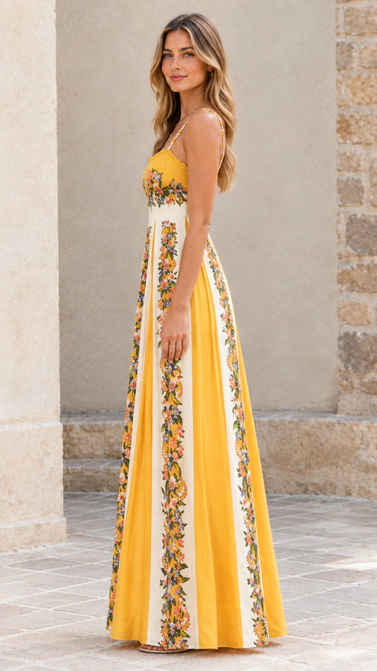 Side profile view of yellow floral pleated maxi dress