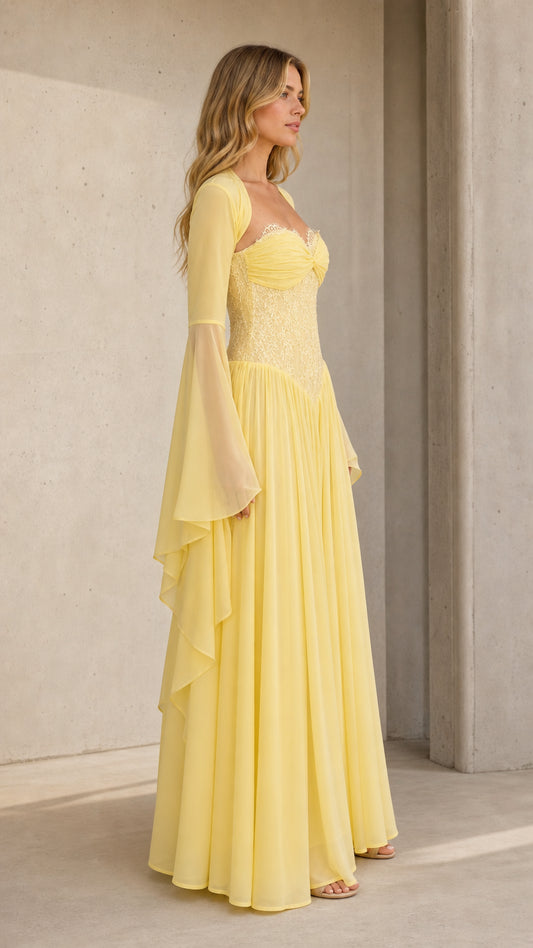Three-quarter angle of model in pale yellow sweetheart evening gown with flared sleeves