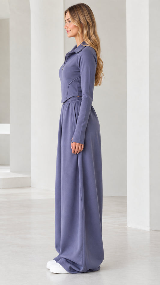 Side profile view of model wearing dusty blue wide-leg lounge two-piece set