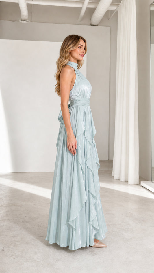 Side profile view of model in sage green evening dress