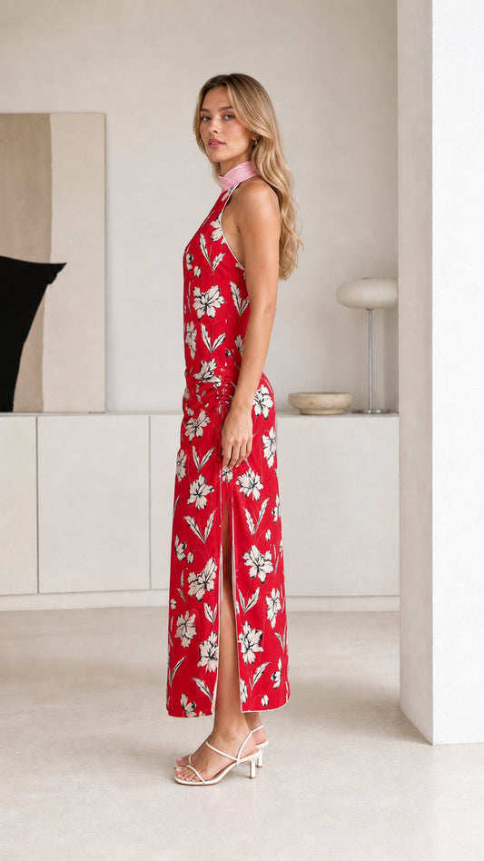 Side view of red floral maxi dress showing side slit
