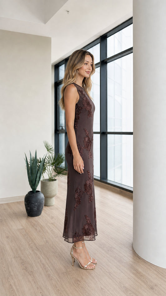Side profile of model in dark brown mesh midi dress