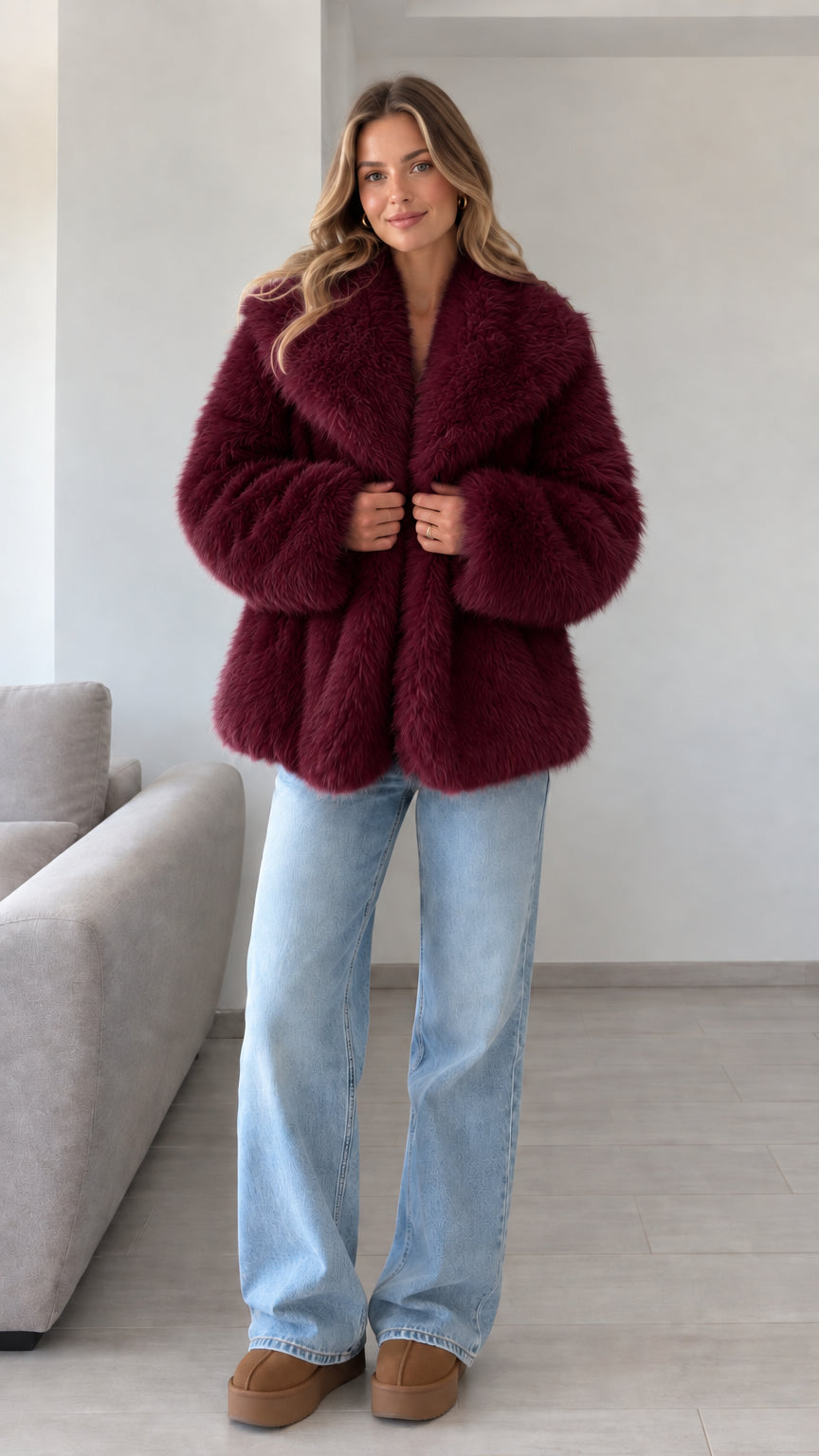 Front view of model wearing burgundy plush faux fur lapel jacket