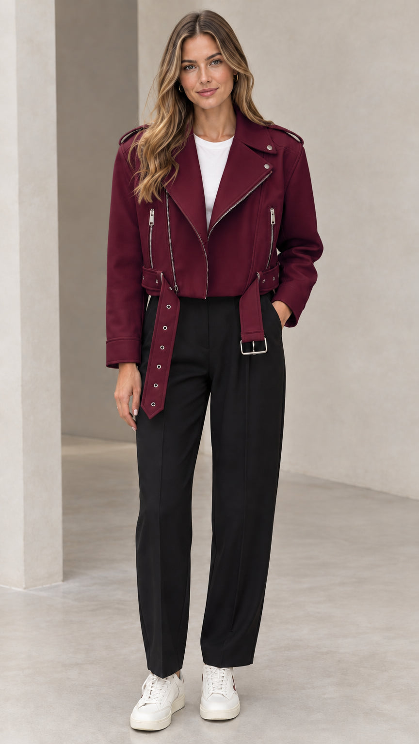 Front view of woman wearing burgundy wine red cropped faux leather moto biker jacket