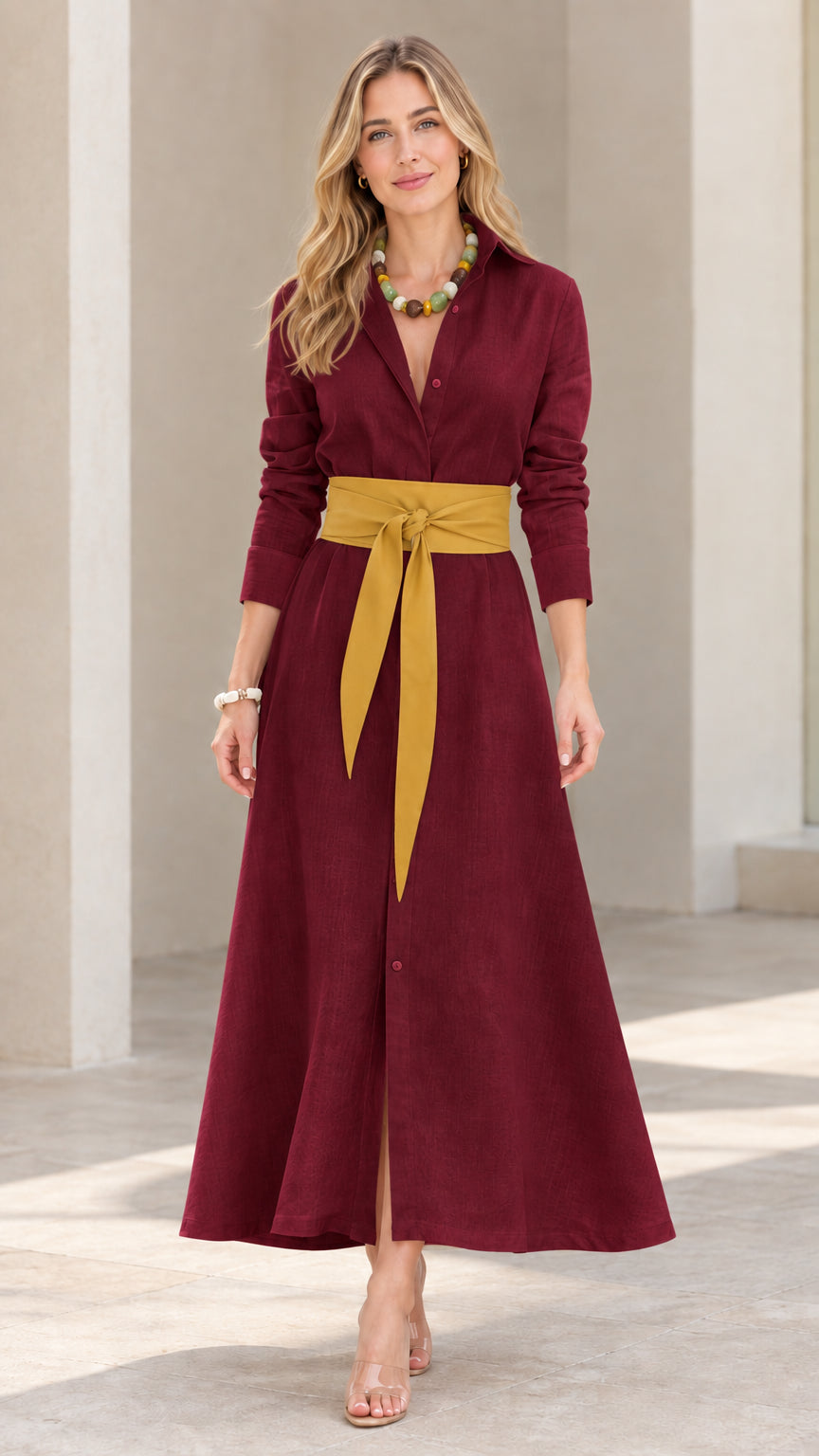 Front view of model wearing burgundy long sleeve maxi shirt dress with yellow sash belt