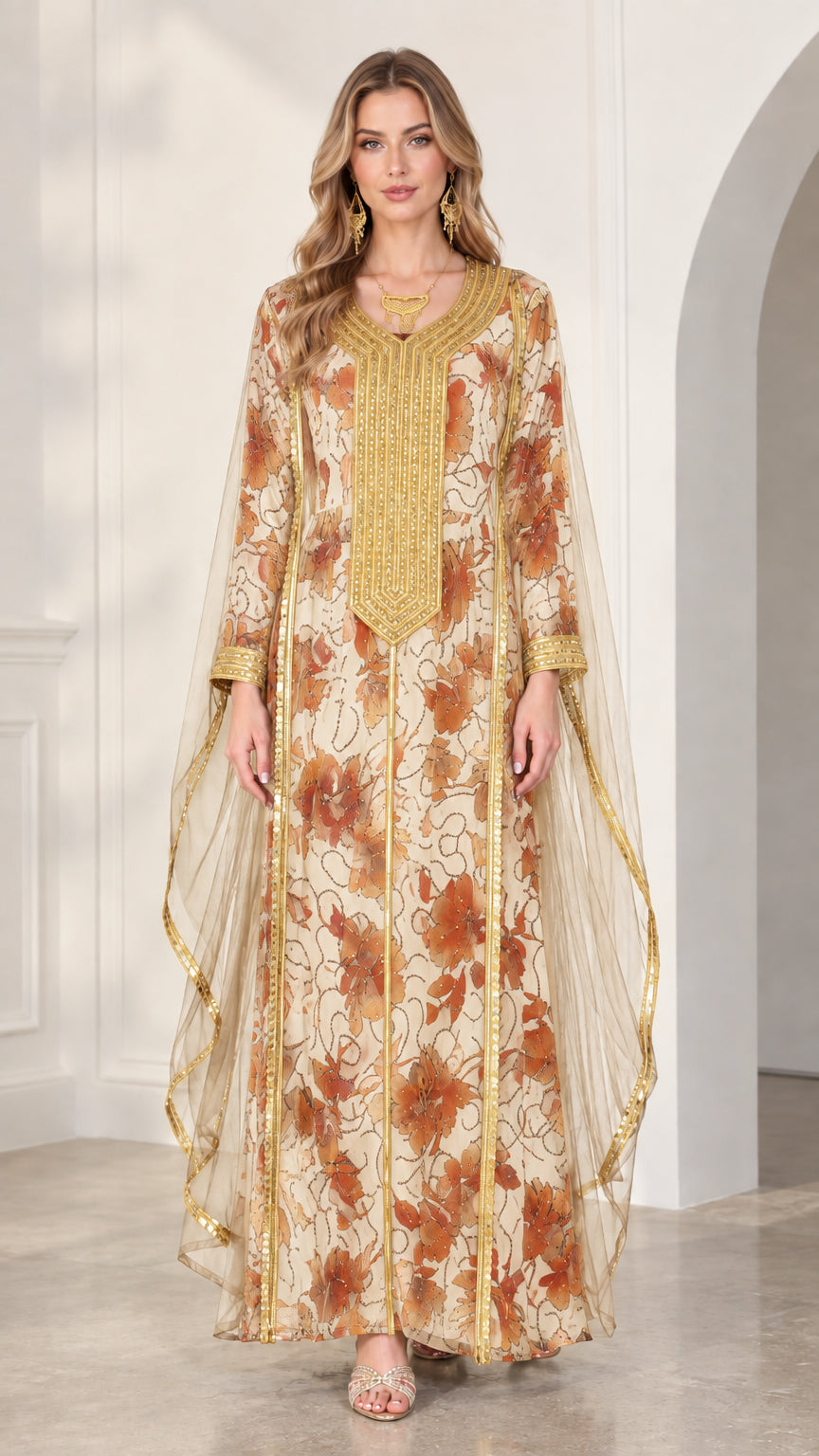 Model wearing cream floral kaftan dress with gold embroidery and lightweight cape sleeves