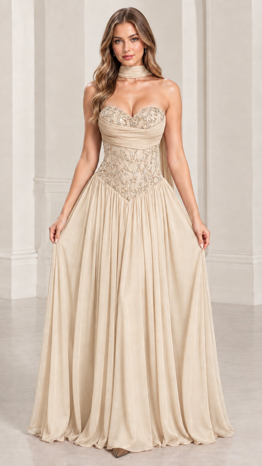 Front view of champagne strapless formal gown with sequin embellished corset