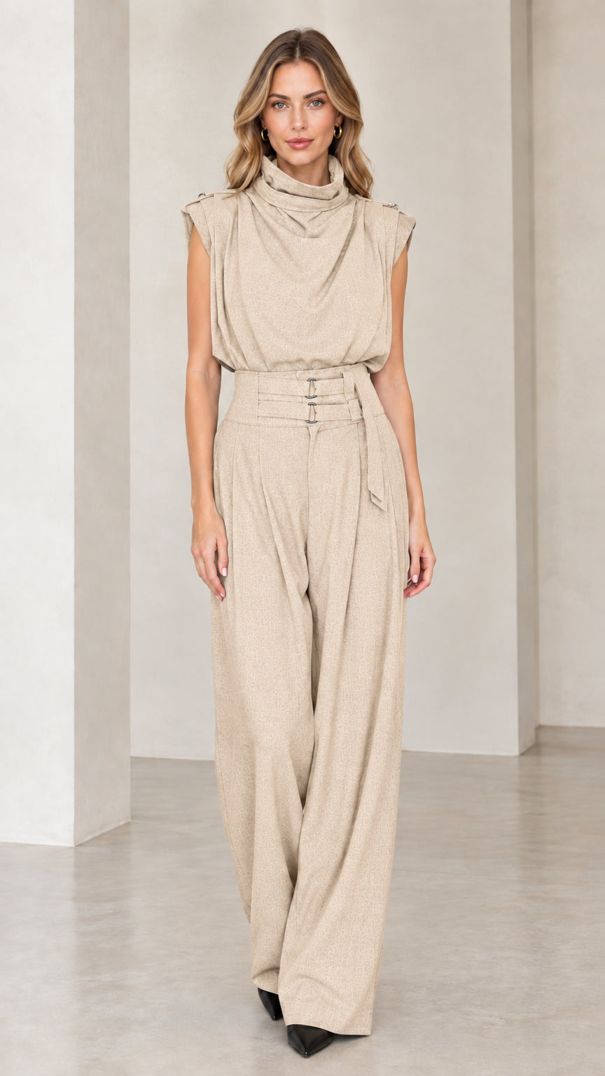 Model wearing beige neutral sleeveless drape high neck wide leg jumpsuit