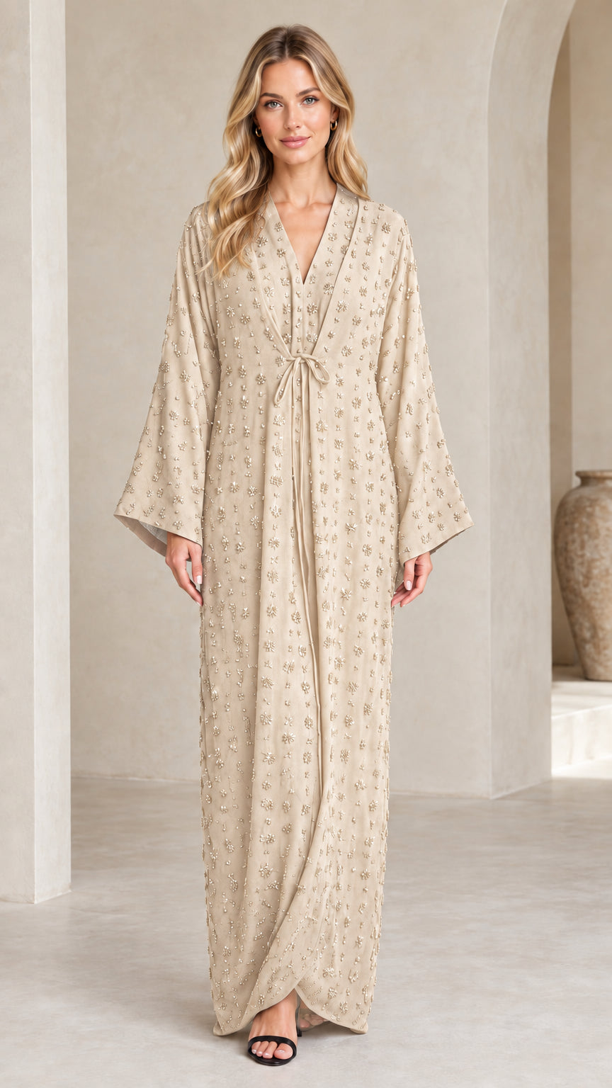 Front view of woman wearing Champagne beige embellished elegant abaya dress
