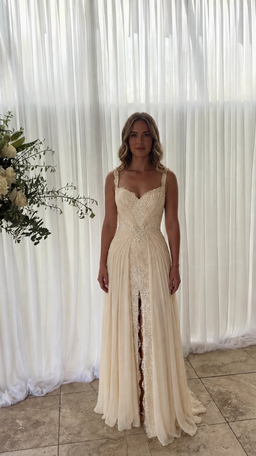 Front view of model wearing champagne cream lace inset chiffon maxi dress