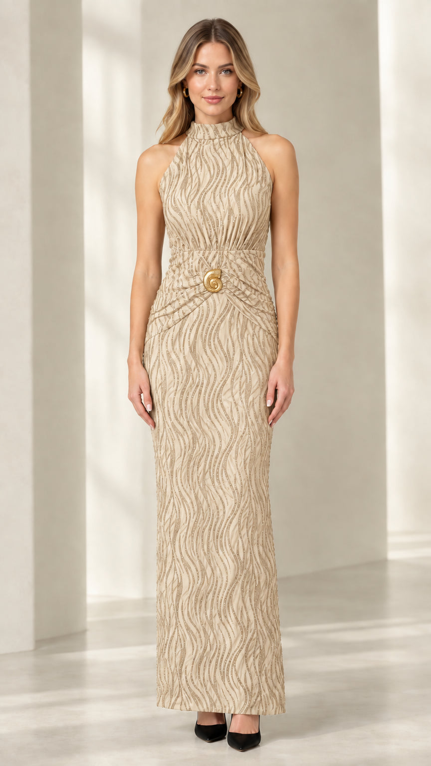 Front view of woman wearing champagne gold textured halter column dress