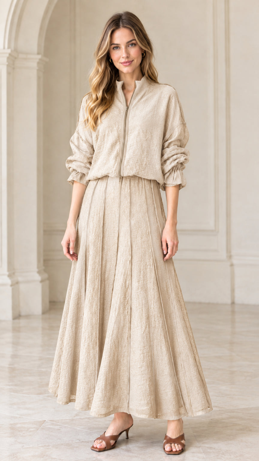 Full front view of beige cream textured zip-front top and pleated maxi skirt set