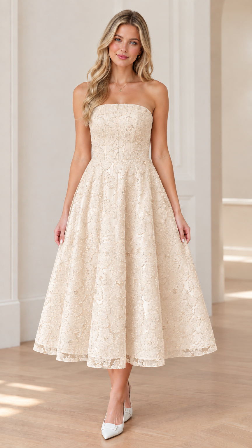 Front view of woman wearing strapless champagne floral lace midi dress