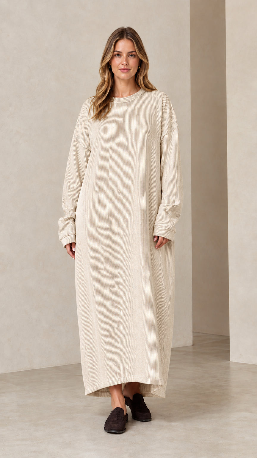 Woman wearing oatmeal beige ribbed knit long sleeve maxi dress