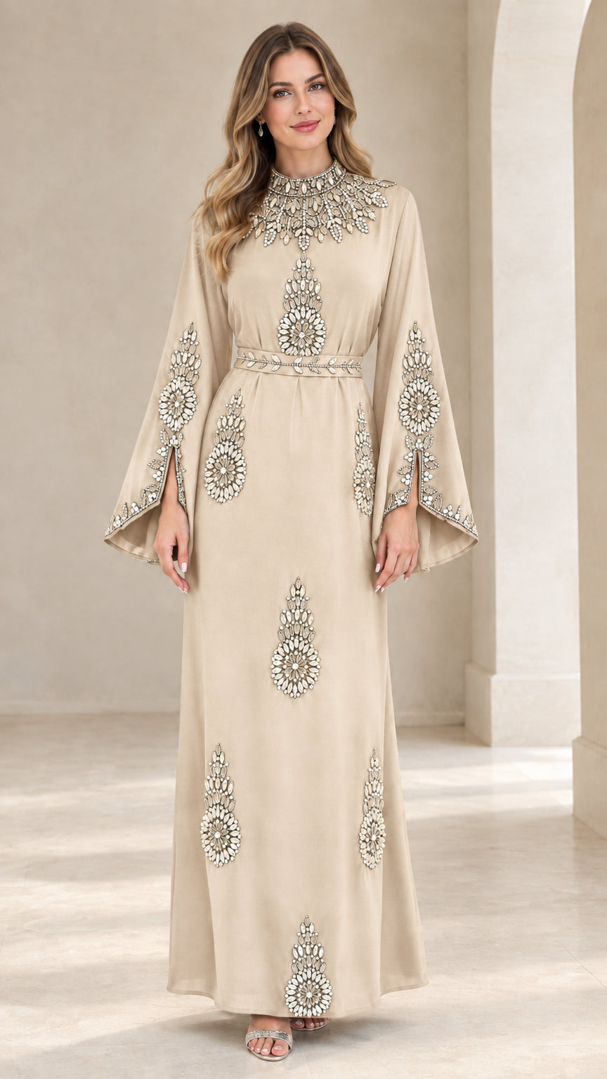 Front view of woman wearing champagne beige rhinestone embellished maxi dress