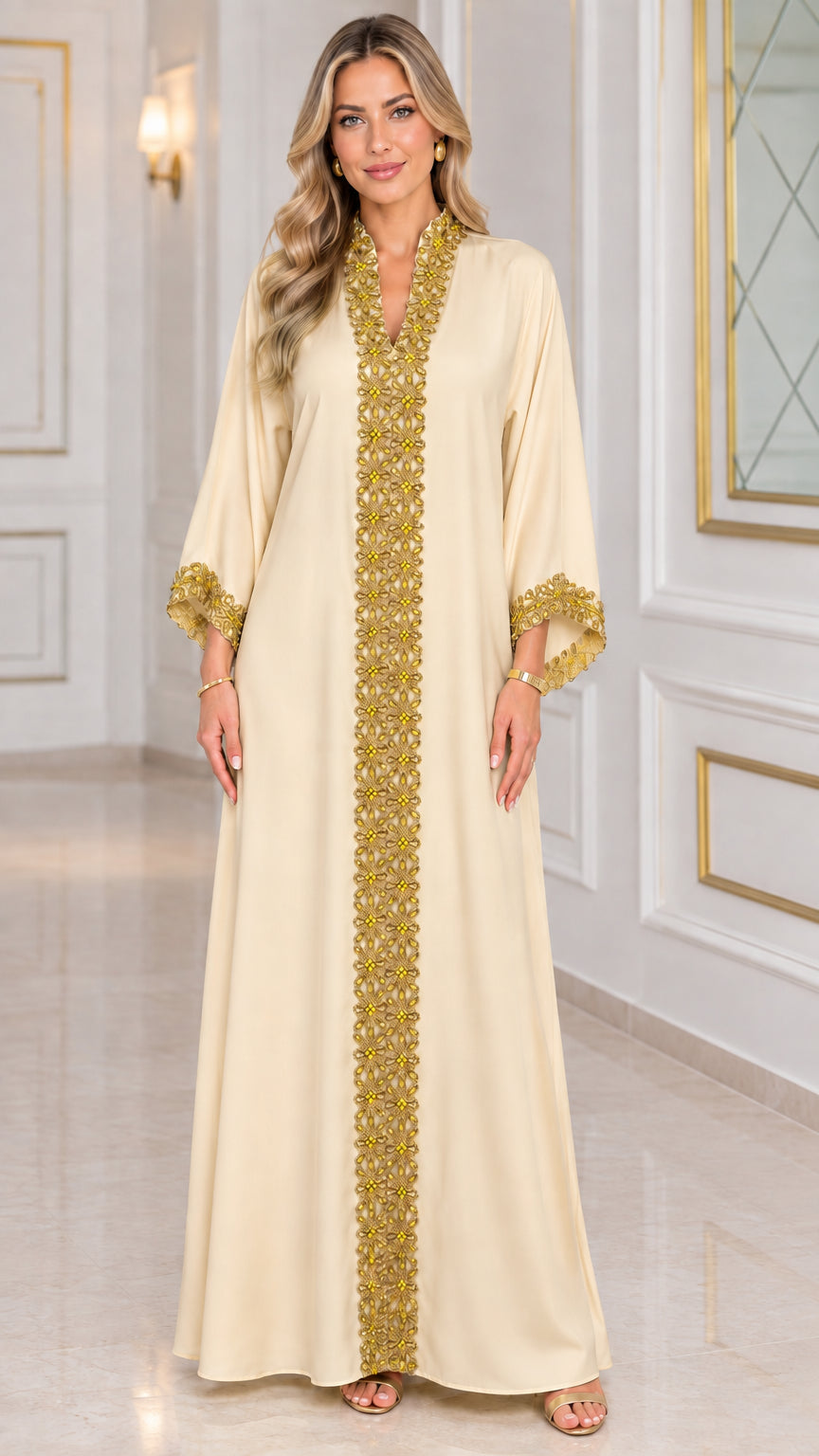 Front view of champagne beige kaftan maxi dress with gold embroidered trim