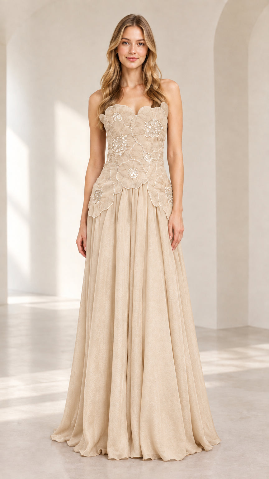 Front view of model wearing champagne strapless floral chiffon evening gown